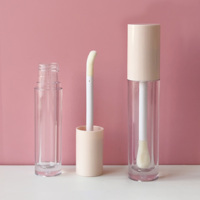 Tube de brillant à lèvres de forme ronde vide de 8ml emballage de tubes de cosmétiques clairs de couleur nue avec de petites brosses de baguette