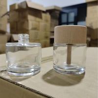 Vente en gros de 50ml de désodorisant clair pour voiture bouteille vide roseau rond diffuseur de voiture bouteille en verre