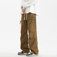 Streetwear Großhandel Maßgeschneiderte Blanko Polyester/Nylon Winddichte Frühlings-Mid-Cut Asymmetrisch Gefärbte Gewaschene Weite Fallschirmjägerhose