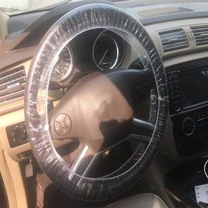Couvercle de <span class=keywords><strong>volant</strong></span> <span class=keywords><strong>jetable</strong></span> en <span class=keywords><strong>plastique</strong></span> extensible, 100 pièces, protecteur pour voiture - Product Image 5