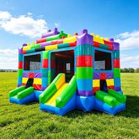 Château gonflable commercial à blocs de construction avec double toboggan pour événements et locations de fêtes pour enfants
