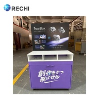 Mesa de mostrador de exhibición de consola de juegos de madera con diseño de accesorio de tienda electrónica RECHI con gabinete de almacenamiento y póster de anuncio cambiable