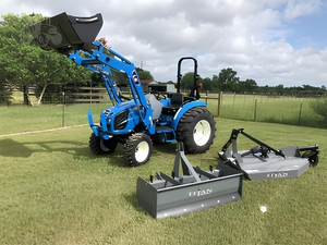 Tracteur compact bleu LS mini, fourre-tout avant et pelle arrière, pour travaux agricoles et aménagement paysager, fourni directement par l'usine - Product Image 1