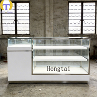 Comptoir d'exposition moderne blanc avec éclairage LED, vitrine coulissante en verre, tiroir avant verrouillable pour bijouterie, magasin de détail, centre commercial