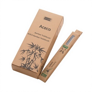 Cepillo de dientes redondo de carbón con mango para adultos, cerdas suaves, venta al por mayor directa de fábrica, artículos de tocador para hoteles y hostales - Product Image 1