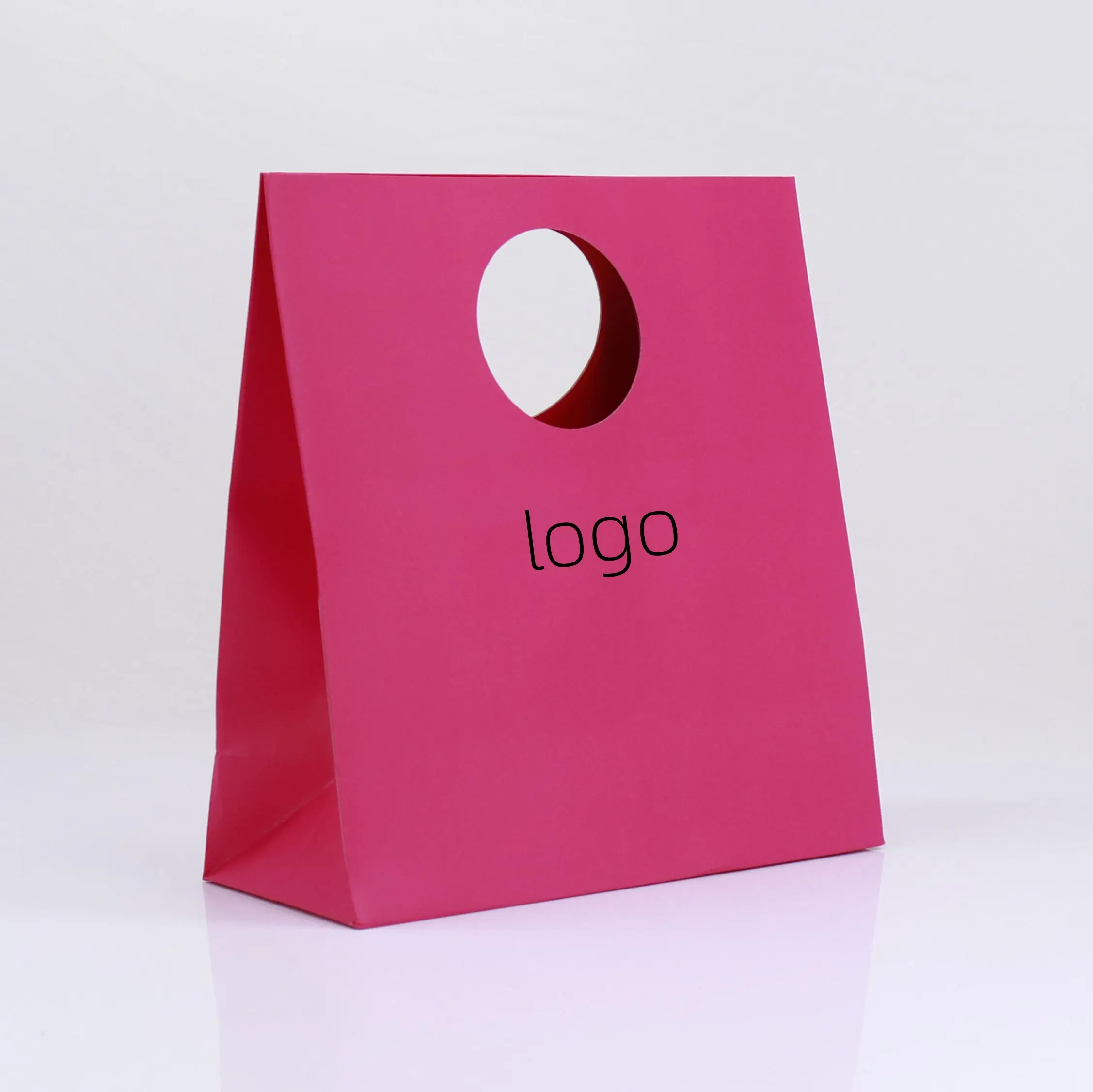fashionable design paper shopping paper bag ,circular die-cut handle gift bag ,wholesale custom retail bags