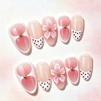 Faux ongles à presser ultra-courts en amande, rose pêche dégradé, à pois 3D sculptés, style français