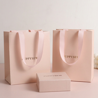 Sac fourre-tout personnalisé avec ruban de couleur et logo sur mesure pour l'emballage de cosmétiques et de shampoings, sac cadeau en papier spécial