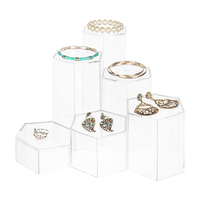 Vente en gros Présentoir hexagonal en acrylique Présentoir à bijoux en acrylique sur pied pour boutique de mariage