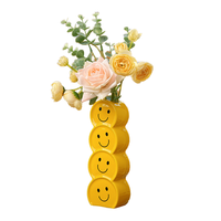 Vase en céramique moderne 2026 en forme de visage souriant pour centre de table de mariage et décoration intérieure