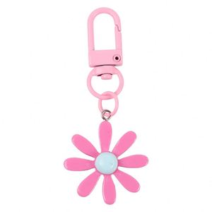 Breloques de sac de luxe en acier inoxydable imprimées en typographie, porte-clés fleur marguerite couleur bonbon pour femmes et filles - Product Image 1