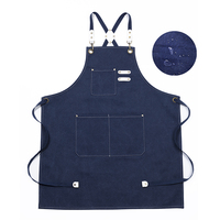 Tablier robuste réutilisable en toile coton-polyester avec logo personnalisé, bretelles réglables croisées sur les épaules et grandes poches pour le jardinage