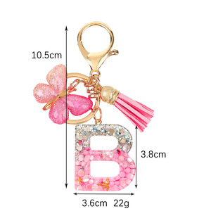 Llavero al por mayor con borla rosa, mariposa y copo de nieve de resina, inicial de la A a la Z, para bolso, mochila, cartera, llavero con alfabeto - Product Image 6