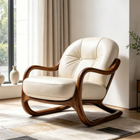 Fauteuil d'appoint en bois massif à cadre courbé continu, base flottante en forme de traîneau, assise simple en cuir capitonnée à grille boutonnée