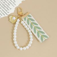 Porte-clés lumineux, cordon pour téléphone, design feuille, pendentif en perle, écouteurs, décoration de fête d'anniversaire, cadeau