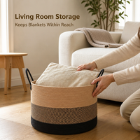 Panier de rangement en corde de coton avec design tressé noir et marron, poignées de transport pour l'organisation des couvertures dans le salon