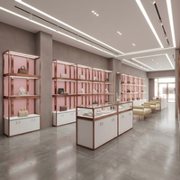 Étagères de présentation pour magasin de vêtements sur mesure, mobilier de présentation rose pour boutique de vêtements féminins, fabricant OEM