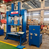 Presse hydraulique à portique de 100 tonnes, utilisée comme machine de pressage pour comprimer les bouteilles de gaz usagées en blocs.