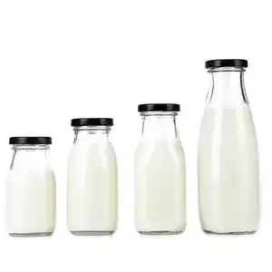 Vente en gros 200ml 250ml 300ml 500ml bouteille de lait en verre rond café boisson bouteilles de jus vides avec couvercle en métal