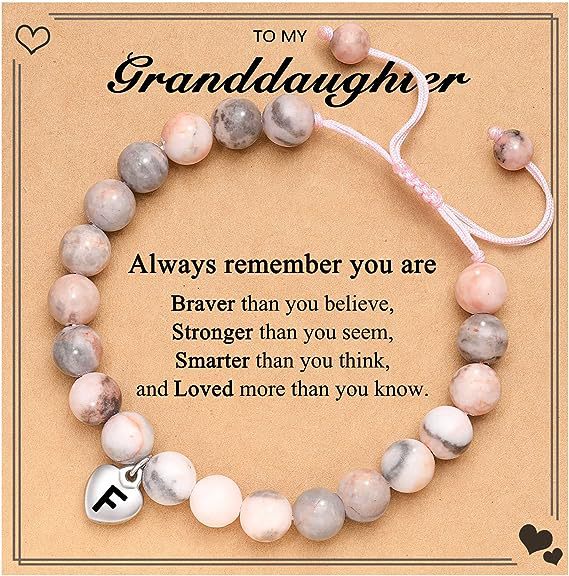Pulsera rosa tejida con cebra y letra F