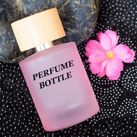Flacon pulvérisateur de parfum rond cylindrique de 30ml 50ml 100ml personnalisé flacons de parfum en verre rose transparent à sertir vides avec boîte tubulaire