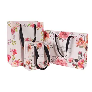 사용자 정의 디자인 공예 핑크 프리미엄 종이 선물 가방 도매 사용자 정의 로고 종이 배송 가방 의류