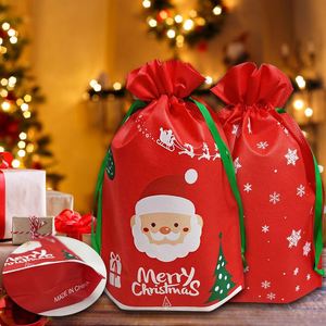 Bolsas de Regalo Navideñas Reciclables de Tela No Tejida con Cordón, 26x36cm, para Empacar Bocadillos en Nochebuena, Diseño de Papá Noel, Disponibles en Stock - Product Image 1