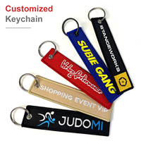 Geborduurde sleutelhangers met aangepast merklogo, bulkverpakking voor vliegtuigvlaggen, jet tags, accessoires & geweven stoffen label sleutelringen