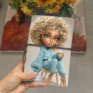 Cuaderno A6 con decoración de hojas, regalo de Año Nuevo para que el primo planifique resoluciones personales con muñeca, gafas de pelo rizado, taza Swea - Product Image 1