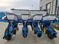Semoir mécanique robuste à 4 rangs pour semis directes de maïs, sorgho et soja, avec système de ramassage par doigts pour une plantation de précision
