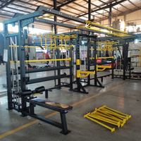 Équipement de gymnastique à domicile chargé par broche câble de musculation croisé rack de puissance formateur multifonctionnel smith machine