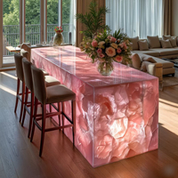 Comptoir de bar d'îlot de cuisine moderne en cristal rose, quartz rose et onyx rétroéclairé avec lumière LED
