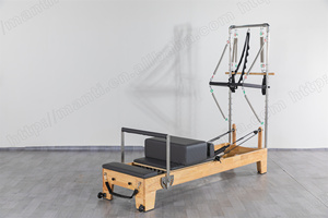 เครื่องพิลาทิสอเนกประสงค์ที่ทนทาน พร้อมเตียงเลื่อนและเตียงแกนกลางสีขาวแบบกึ่งยกสูง  พร้อมอุปกรณ์ทาวเวอร์รีฟอร์เมอร์ไม้ - Product Image 3