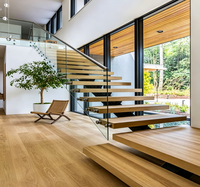 Escalier droit sur mesure de luxe avec poutre centrale dissimulée et marches en marbre/bois pour villa