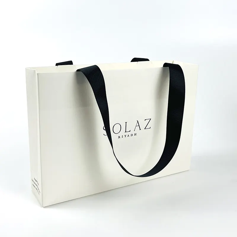 Bolsa de papel blanca personalizada de fábrica, Impresión de logotipo, bolsa de papel de regalo de compras con asa de cinta