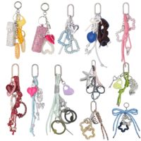 Attache-cheveux en spirale style Y2K mignon, porte-clés décoratif en forme de cœur, nœud en forme de nœud papillon, charme bleu métallique argenté, corde à nœuds, pompon, breloques tendance pour sac
