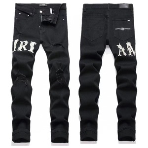 Jean en denim déchiré et brodé AMIRI, haute couture, délavé, tendance, exclusivité transfrontalière - Product Image 1
