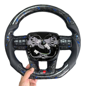 พวงมาลัยคาร์บอนไฟเบอร์หุ้มหนังแบบสปอร์ต 4 ก้าน ยี่ห้อเจียนซาน สำหรับรถยนต์แลนด์ครุยเซอร์ LC79/LC76/LC70/LC300 แคมรี่ โคโรลล่า - Product Image 1