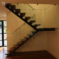 Escalier central moderne Tanlong en bois avec garde-corps en verre sans cadre, escalier industriel à marches ouvertes sur mesure