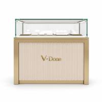 Vitrine d'îlot à bijoux en or brossé avec tiroirs de rangement, comptoir de présentation de bijoux en verre trempé à LED pour boutique de luxe