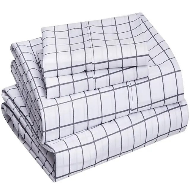 Four - Piece Set of Printed Bedding With Black Lines on White Background