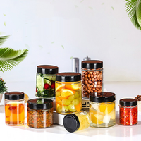 Emballage de pot de bouteille rond grands pots ronds clairs en verre avec couvercles noirs pour le stockage pot de miel alimentaire pour emballage alimentaire en conserve