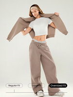 Ensemble de survêtement pour femme avec sweat à capuche et pantalon large à taille élastiquée et poches latérales, fabriqué en usine par la marque Cut and Sew Manufacturer