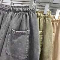 Celana pendek cuci asam kustom pria, 2025 katun polos hitam ukuran besar kosong keringat musim panas 100