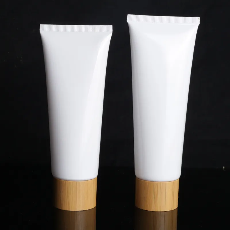 Tubos de plástico blanco para crema facial, tapa de tornillo de bambú para el cuidado de la piel, 50g, 80g, 100g, venta al por mayor