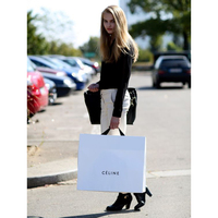 Venta al por mayor de boda de lujo bolsa de embalaje de regalo de logotipo personalizado a granel simple cinta de embalaje de ropa pequeña de compras de papel bolsa de regalo