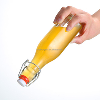 Offre Spéciale bouteille en verre à couvercle pivotant de 250ml bocaux en verre avec couvercle supérieur pivotant bouteille de bière en verre transparent avec couvercle supérieur pivotant