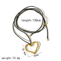 Collier personnalisé avec chaîne longue en corde cirée réglable, associé à un pendentif en forme de cœur en acier inoxydable, bicolore or et argent