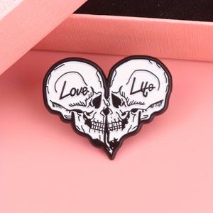 Punk Paradox "Love & Life" Heart Pin - Contrast Skull Duo avec contour noir et typographie gothique pour journaux et denim - Product Image 1