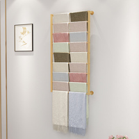 Étagère murale en métal doré pour l'affichage de tapis, de carpettes et d'écharpes, mobilier pour boutique de tissus